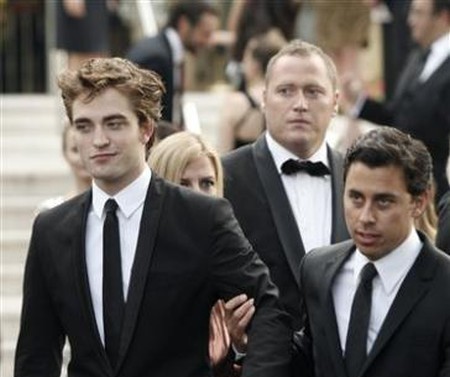 2441865270-british-actor-robert-pattinson-left-arrives-for-the-amfar-cinema