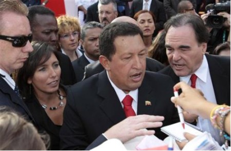 811367659-venezuelan-s-president-hugo-chavez-center-signs-autographs-as-he []