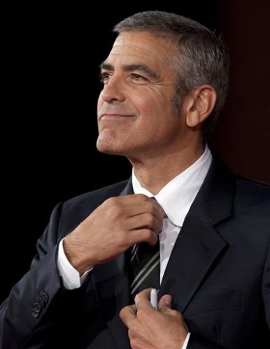 3313631342-us-actor-george-clooney-adjusts-his-tie-as-he-arrives