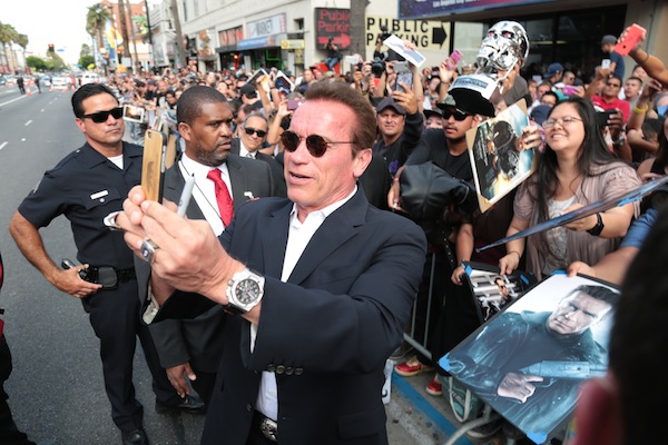 Arnold Schwarzenegger takes a selfie with fans as Paramount Pictures presents the Los Angeles premiere of "Terminator Genisys" at the Dolby Theatre in Los Angeles, California on Sunday, June 28, 2015.  (Photo: Alex J. Berliner/ABImages)